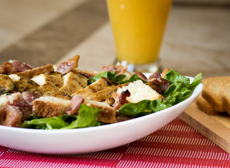 Caesar salad with chicken and fresh vegetables