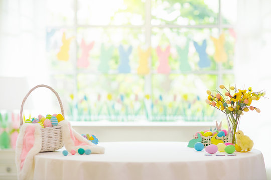 Easter home decoration. Eggs basket and bunny.