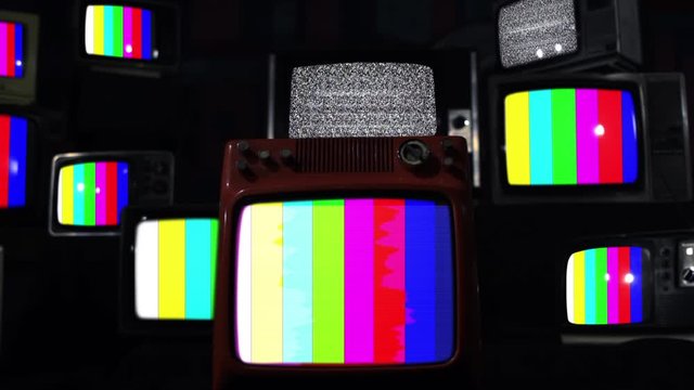 Stacks of Retro Televisions With Color Bars on the Screens. 