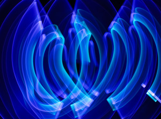 Curved abstract shape made with a light saber violet. Lightpainting session at night. Leds light effect.	 Background for wallpaper.