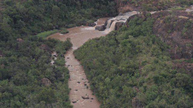 Waterfall in river in Laikipia, Kenya. High aerial drone view of Kenyan landscape