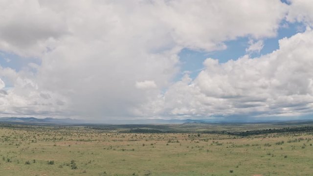 African savanna and plains landscape in Laikipia, Kenya. Aerial drone right to left
