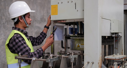 Cropped shot view Manager Technical Industrial Engineer working and control robotics with monitoring system software and industry network connection on tablet.