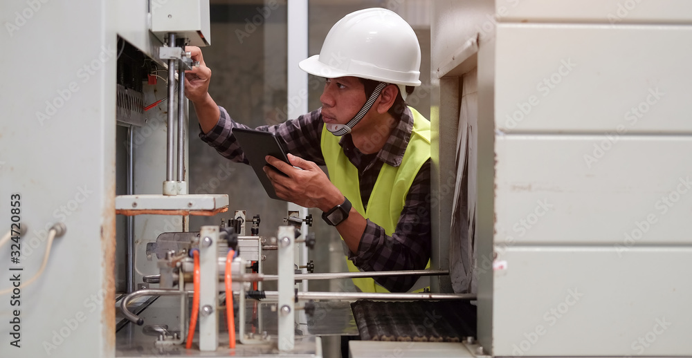 Poster cropped shot view manager technical industrial engineer working and control robotics with monitoring