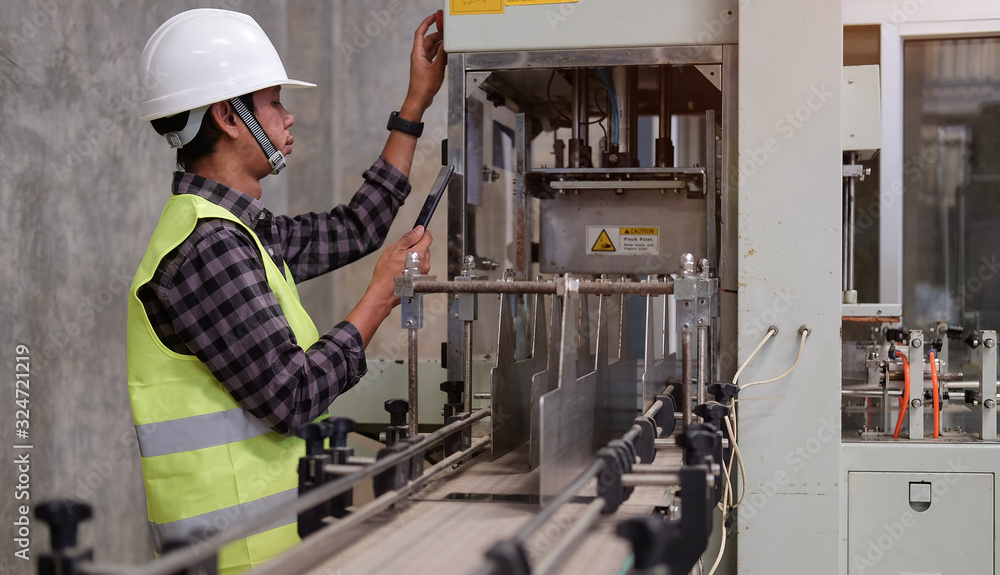 Poster cropped shot view manager technical industrial engineer working and control robotics with monitoring