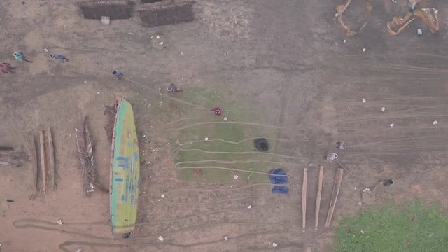 Fishermen working on fishing nets, Varkala, India. Top down aerial drone view