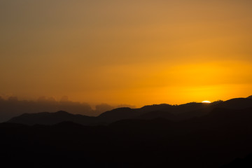 dramatic colourful sunset image in the caribbean mountains of the dominican republic.