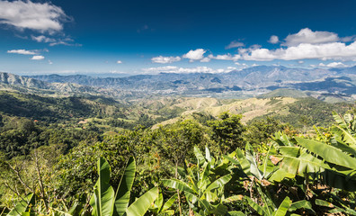 dramatic image high in the mountains of the dominican republic looking down on the town of Ocoa.
