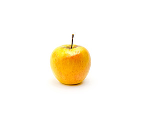 Yellow apple close-up on a white background.