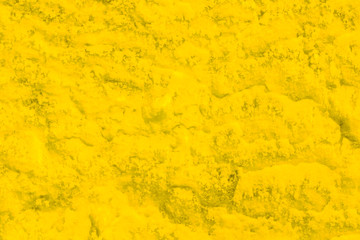 orange golden decorative plaster background, ginger stucco wall with copyspace, abstract wallpaper close up ,yellow texture macro