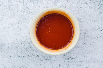 Homemade tomato chilly red paste sauce in saucepan. Vegan vegetarian diet food