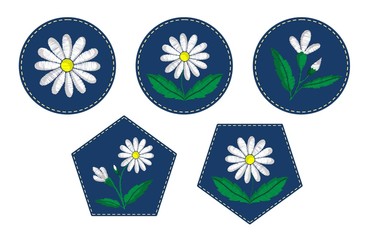 White satin stitch daisies embroidered on blue emblems