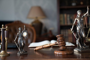 Lawyers office concept. Law symbols composition: gavel, scale and Themis statue.