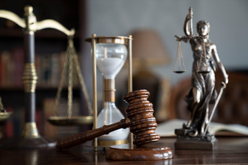 Lawyers office concept. Law symbols composition: gavel, scale and Themis statue.
