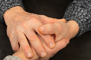 Wrinkled elderly hands