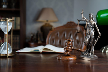 Lawyers office concept. Law symbols composition: gavel, scale and Themis statue.