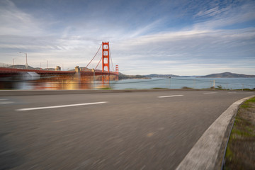 blurred highway in the background of golden gate bridge