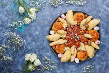 Traditional Azerbaijan holiday Novruz cookies baklavas and shakarburas on black tray plate on dark background