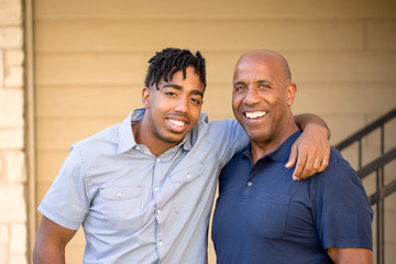 African American father and his adult son.