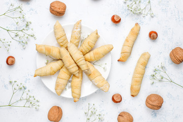 Traditional Azerbaijan holiday Novruz cookies mutaki on white plate on light background