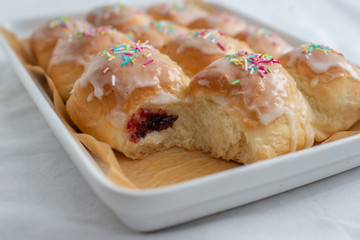 Traditional Polish donuts on wooden background. Tasty doughnuts with jam