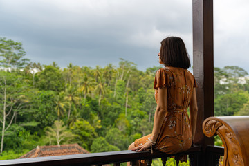 Young brunette woman enjoying beautiful exotic landscape