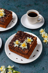 Tasty homemade chocolate truffle cakes with coffee on dark background