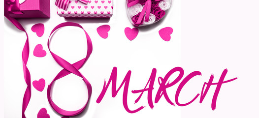 8 March. Happy Womens Day text. Decorative pink bow with gift box isolated on white background.