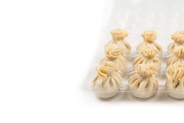 Khinkali on white background.