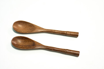 Close up spoon wood on white background.