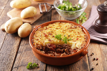 baked mashed potato with minced beef and salad