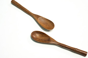 Close up spoon wood on white background.