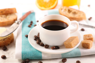 coffee cup with bread and orange