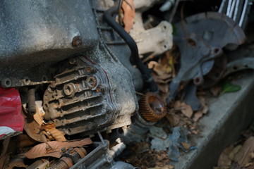 Junk yard full of car's part , engine , body.