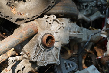 Junk yard full of car's part , engine , body.