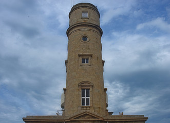 Fototapeta na wymiar Big stone lighthouse near Cherbourg, France