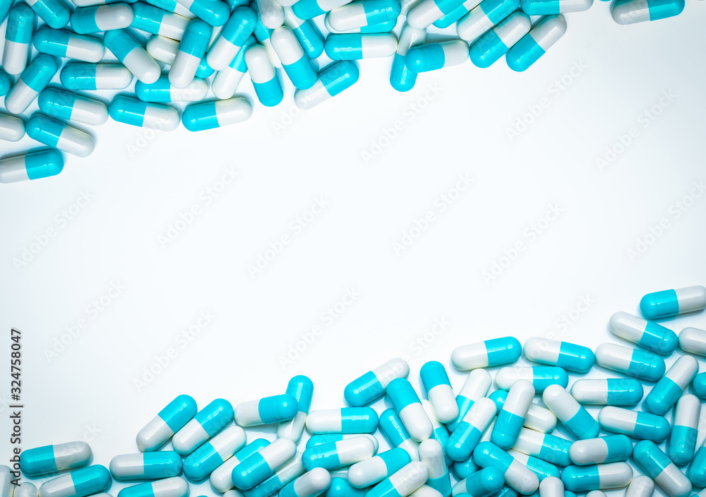 Canvas Prints Blue-white antibiotic capsule pills on white background. Antibiotic drug resistance concept. Pharmaceutical industry. Antimicrobial medicine. Pharmacy product. Drug pills frame for health information.