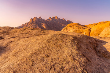 The Pondoks near the Spitzkoppe mountain at sunset in Namibia in Africa.