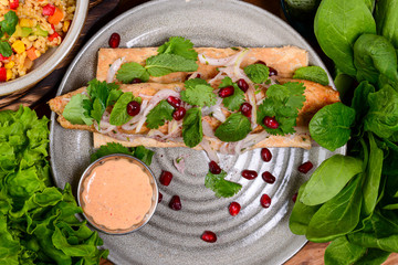 Traditional georgian cuisine - Grilled beef steak with pomegranate and basil close-up on a plate on...