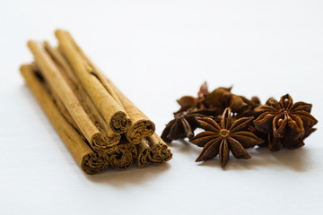 cinnamon and anise stars on a white background