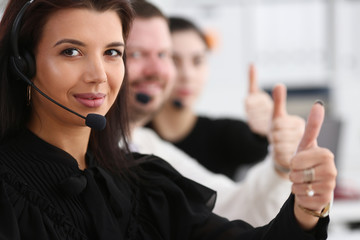 Three call centre service operators arm show OK or confirm at work. High level and quality aid okay symbol effective mediation adviser negotiation participation solve problem real time concept