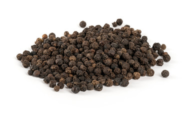 Heap of raw, natural, unprocessed black pepper peppercorns over white background