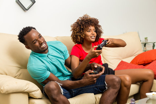 Black African American Couple Having Fun Playing Video Games