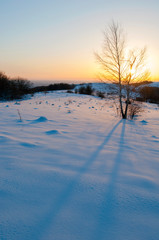 Fototapeta na wymiar sunrise in the winter mountains on a sunny day