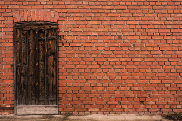 Old brick wall with a wooden door