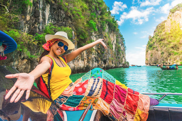 Happy traveler Asian woman in summer dress joy fun relaxing on boat at Pileh lagoon Krabi, Leisure tourist travel Phuket Thailand summer holiday vacation trip, Tourism beautiful destination place Asia