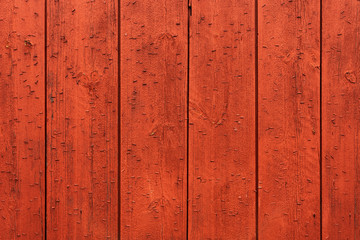 Red wooden wall of a Norwegian cabin or barn