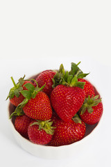 bowl with strawberries isolated on white background