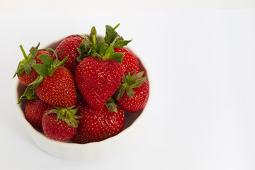 bowl with strawberries isolated on white background