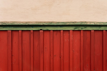 Red wooden wall of a Norwegian cabin or barn